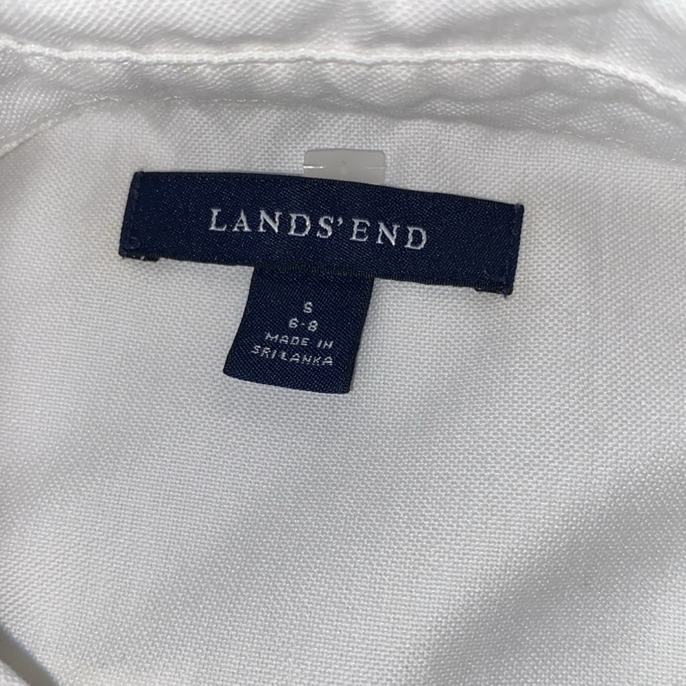 Men’s small white button tee.